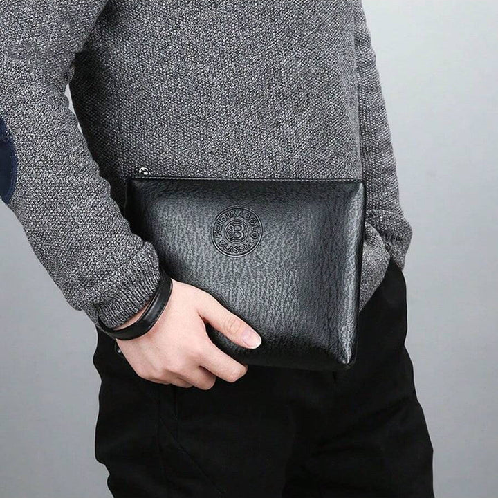 Men's black leather zip clutch wallet for business. Professional, slim design for cards & cash.