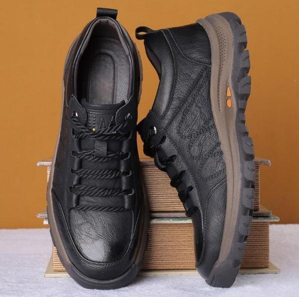 Lightweight men's orthopedic walking shoes in a dark color, providing arch comfort & posture correction.