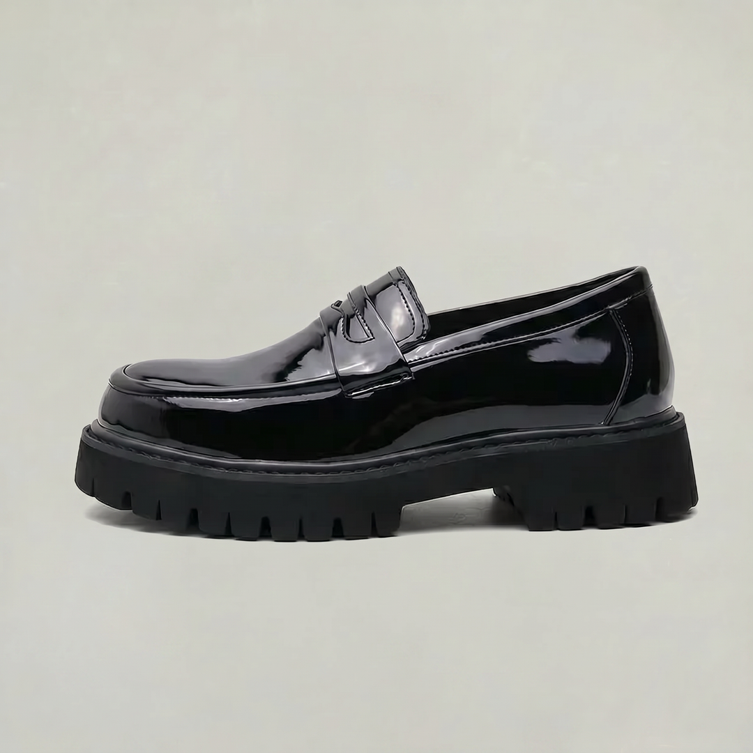 Men's black platform penny loafers, sleek slip-on dress shoes for modern smart casual and workwear fashion.