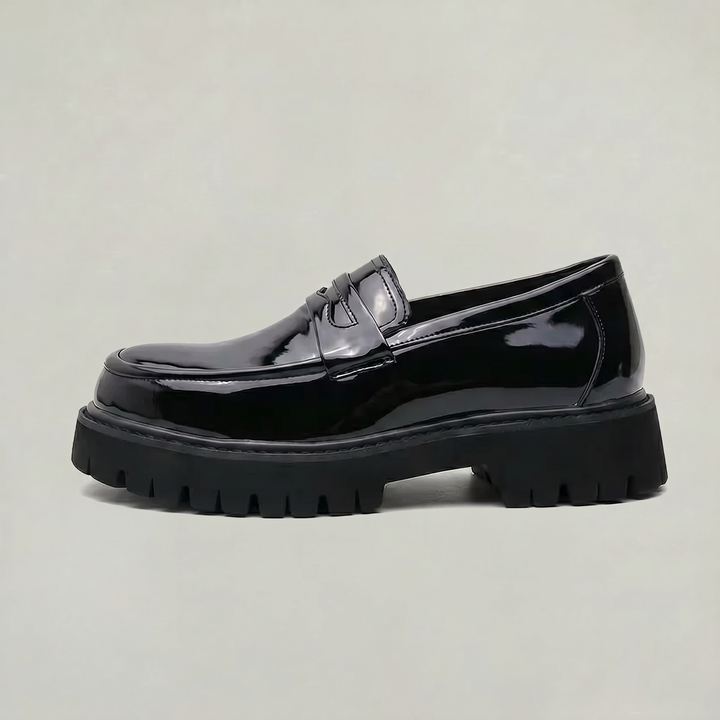 Men's black platform penny loafers, sleek slip-on dress shoes for modern smart casual and workwear fashion.
