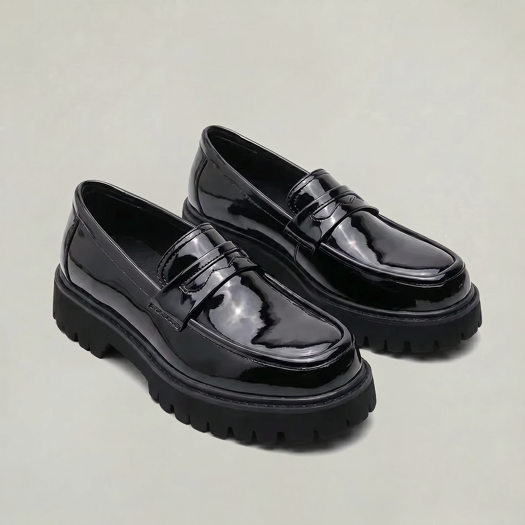 Classic men's penny loafers updated with a sleek platform, comfortable slip-on shoes for work or casual style.