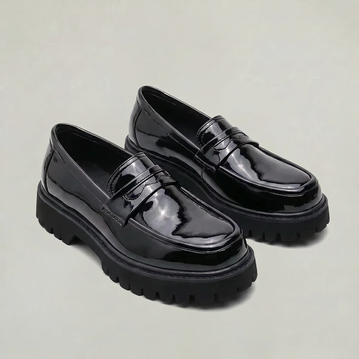 Classic men's penny loafers updated with a sleek platform, comfortable slip-on shoes for work or casual style.