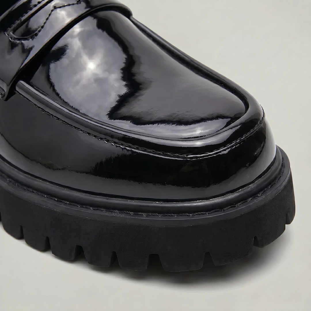 Front view of men's black platform slip-on loafers, versatile dress shoes for a smart casual modern look.