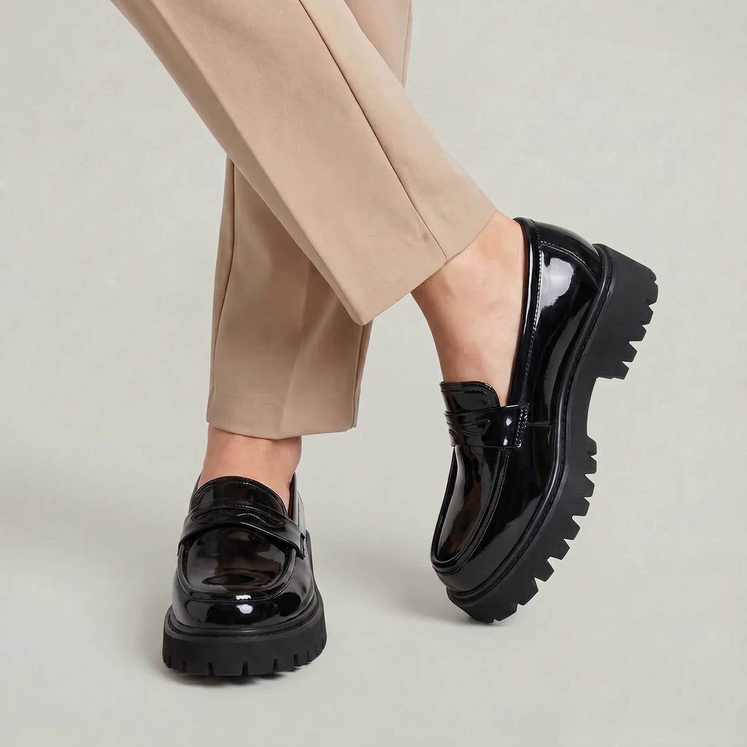 Side profile of men's chunky sole platform penny loafers, stylish slip-on fashion shoes for urban men.