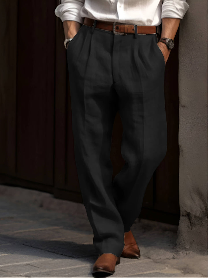 Men's black pleated relaxed fit casual pants with elastic waist. Comfortable & stylish for everyday wear.