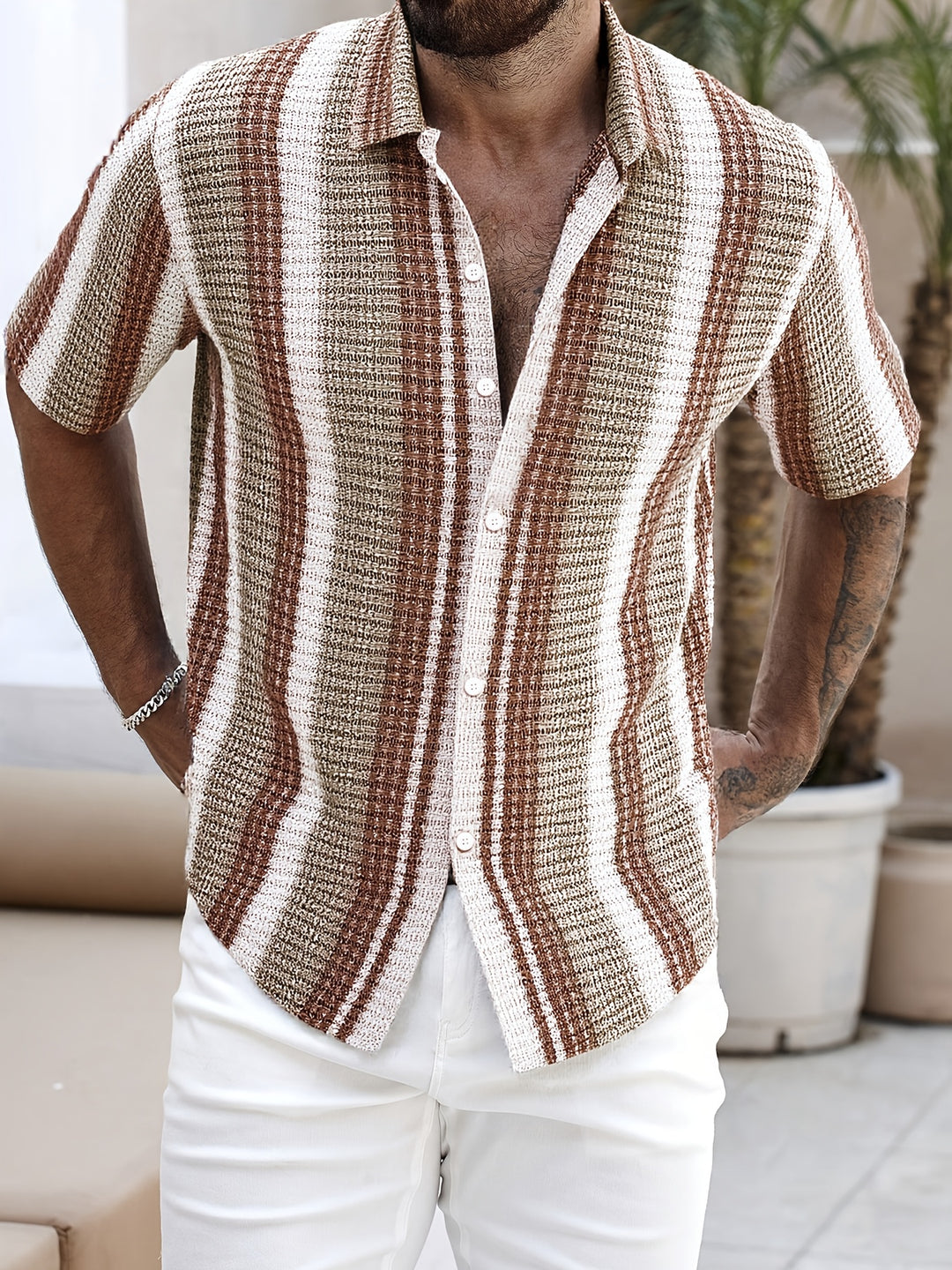 Stylish men's printed short sleeve button-up shirt. Relaxed fit, perfect for summer, beach wear & casual outings.