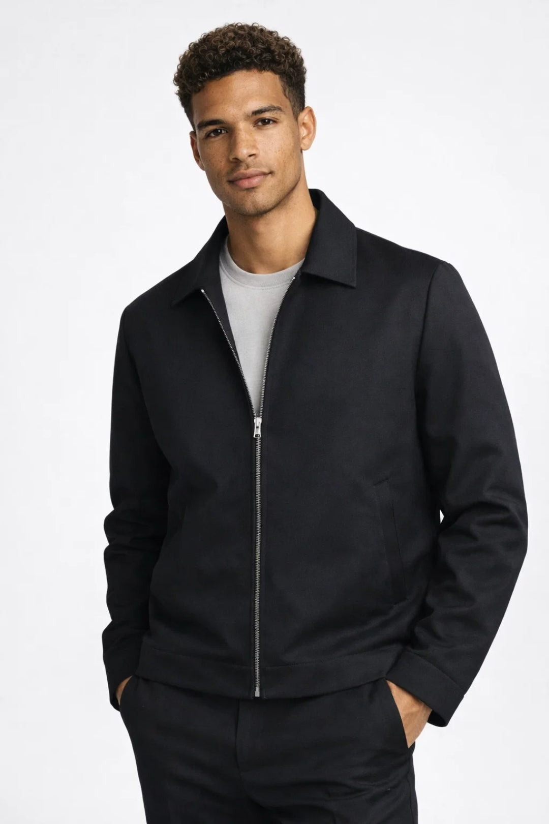 Men's black slim fit zip jacket, perfect for smart casual style & transitional outerwear. Lightweight & versatile.