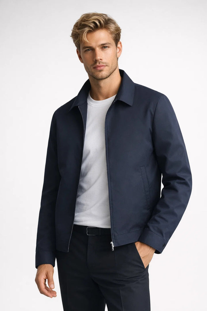 Dark blue men's slim fit zip jacket, a smart casual fashion essential. Versatile transitional outerwear for men.