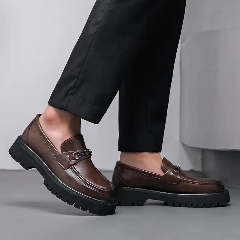 Comfortable men's slip-on loafers with a distinctive metal buckle, great for formal shoes & office wear.