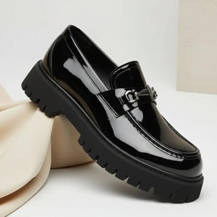 Classic men's formal slip-on loafers with a sophisticated metal buckle, enhancing any business attire.