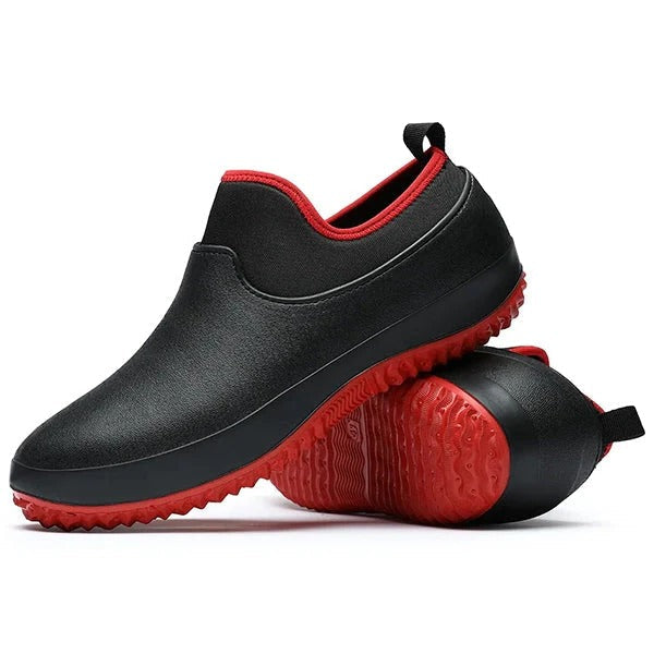 Men's black waterproof slip-on work shoes with non-slip sole, ideal for safety & all-day comfort.