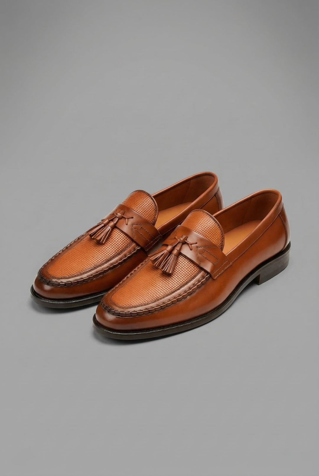 Sophisticated men's slip-on shoes: woven loafers with tassels for office fashion.