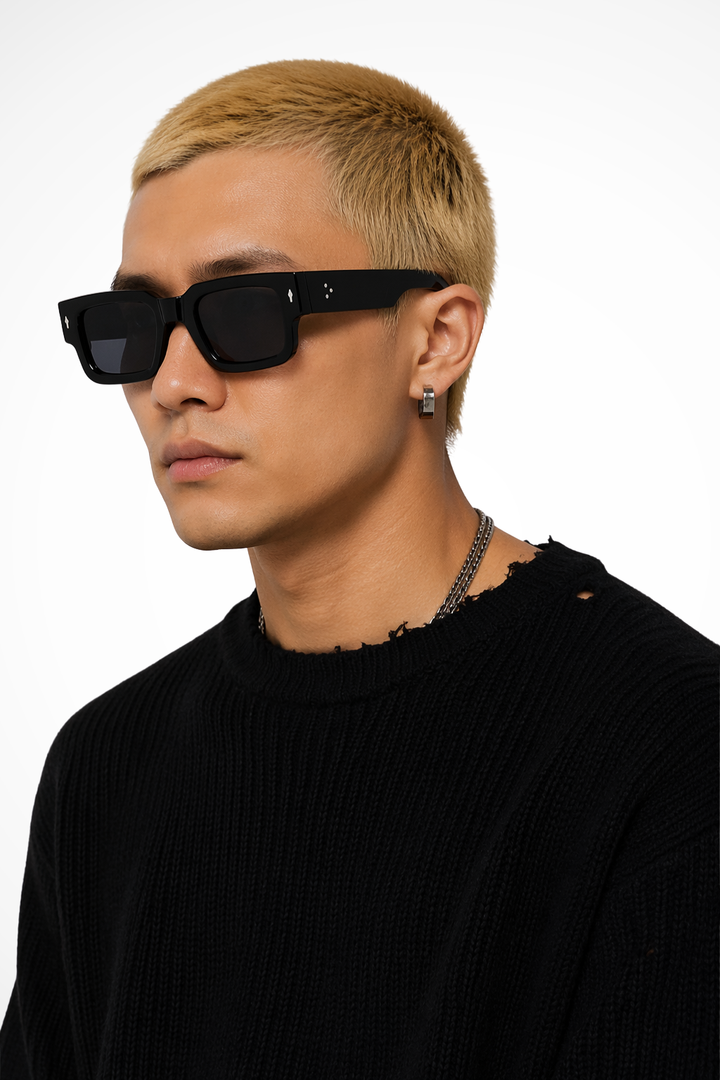 Fashionable men's bold rectangle sunglasses with tinted lenses, a key modern eyewear accessory.
