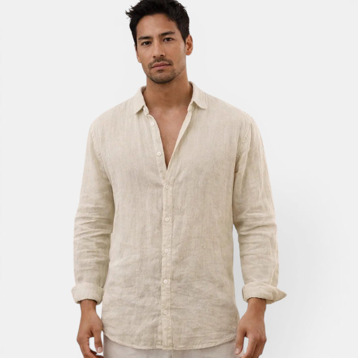 Relaxed fit men's button-up shirt, ideal for warm weather, offering sophisticated casual style.