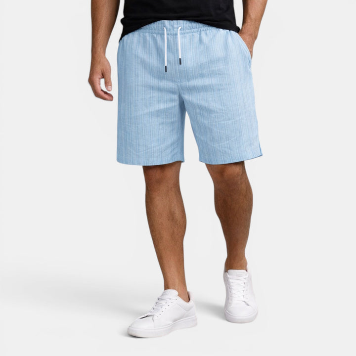 Comfortable breathable men's shorts, regular fit, ideal for beachwear & warm days.