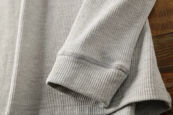 High-quality men's waffle henley, long sleeve, soft, and breathable for casual wear.