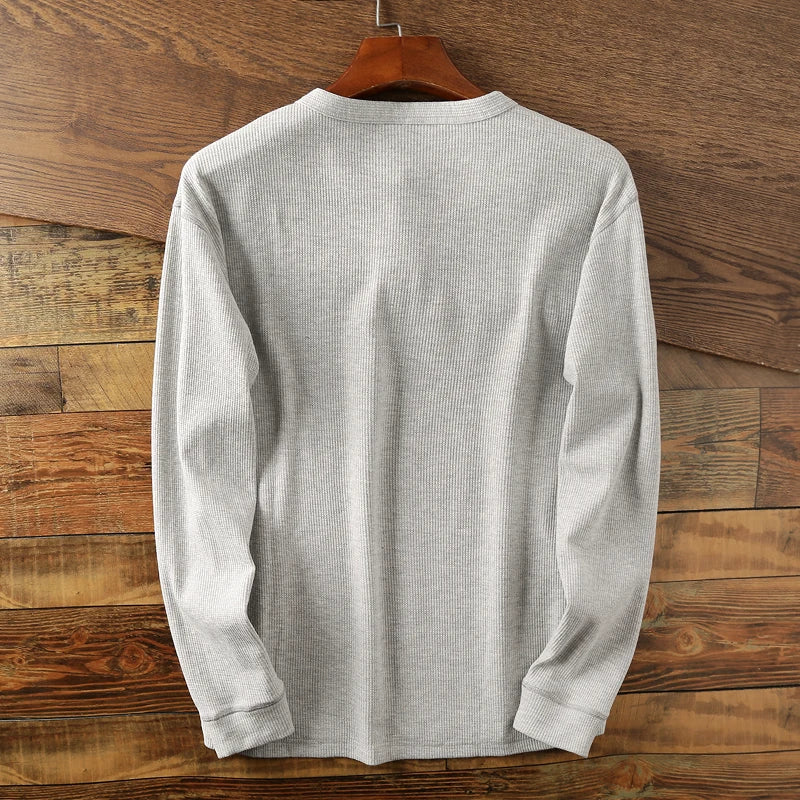 Minimalist men's waffle henley shirt for a smart casual look, breathable & soft.