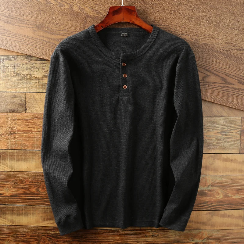Breathable men's henley top with waffle texture, perfect for relaxed casual style.