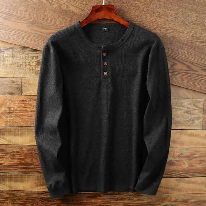 Breathable men's henley top with waffle texture, perfect for relaxed casual style.