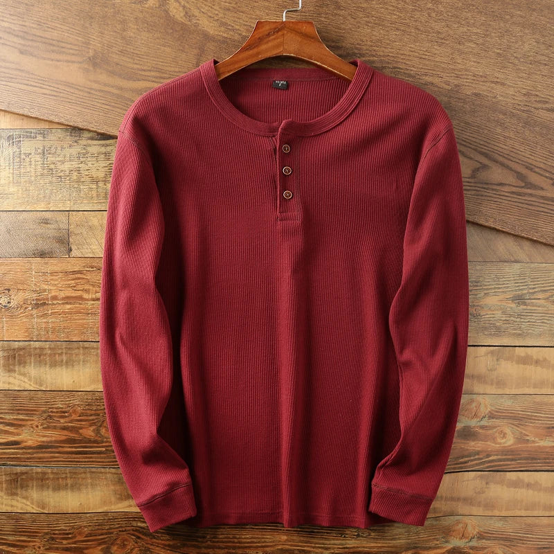 Men's comfortable waffle knit henley shirt, long sleeves for versatile everyday wear.