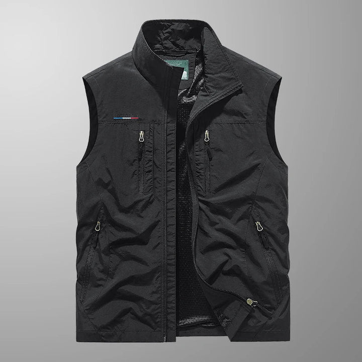 Lightweight men's utility vest with many pockets for essentials. Ideal breathable summer gear for fishing & hiking.