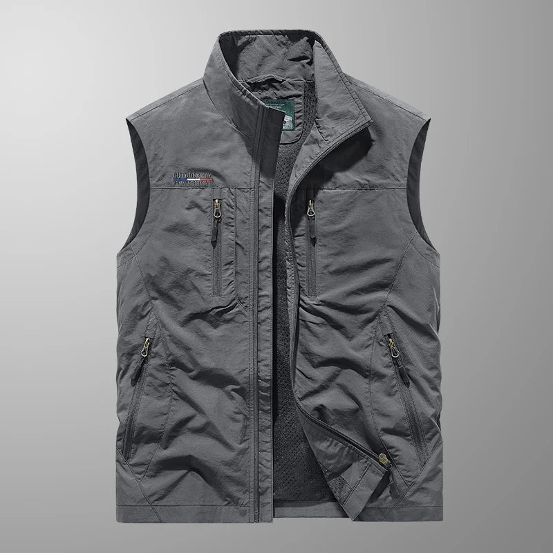 Close-up of a men's multi-pocket fishing vest, showing durable, breathable fabric for outdoor utility.