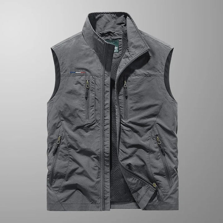 Durable men's fishing vest or hiking vest with breathable mesh and ample cargo pockets for gear.
