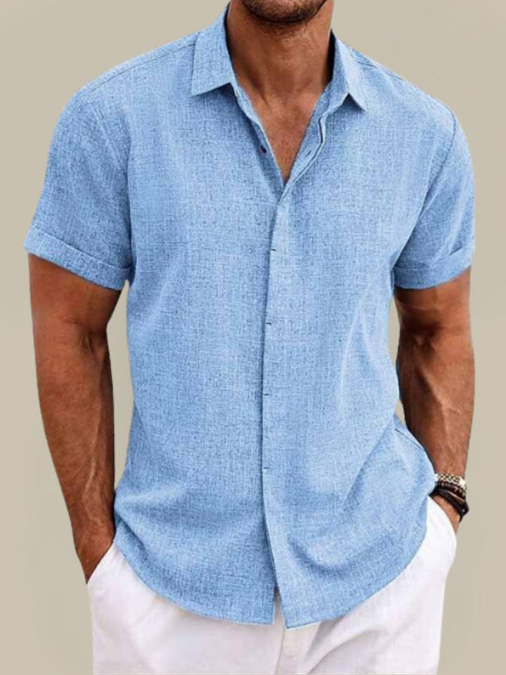Casual men's short sleeve button-up shirt. Breathable fabric, relaxed fit, ideal for summer and warm weather.