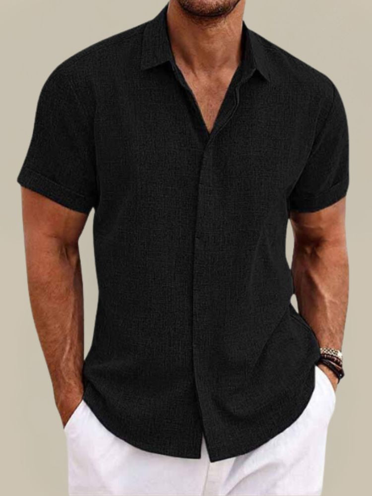 Versatile men's breathable short sleeve button-up. Lightweight, relaxed fit summer shirt for casual wear.