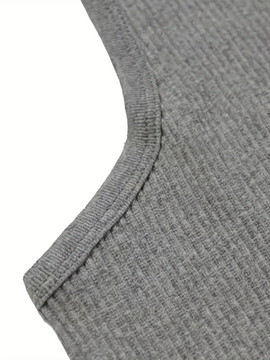 Folded lightweight men's summer tank top, highlighting its versatile and travel-friendly design. Breathable fabric.