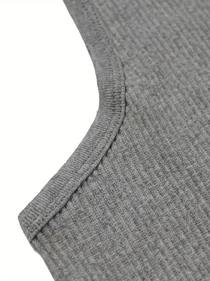 Folded lightweight men's summer tank top, highlighting its versatile and travel-friendly design. Breathable fabric.