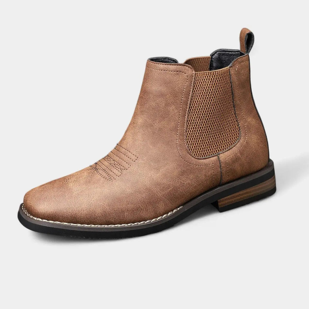 Men's brown leather Chelsea boots with western stitch. Slip-on ankle boots, smart casual style.