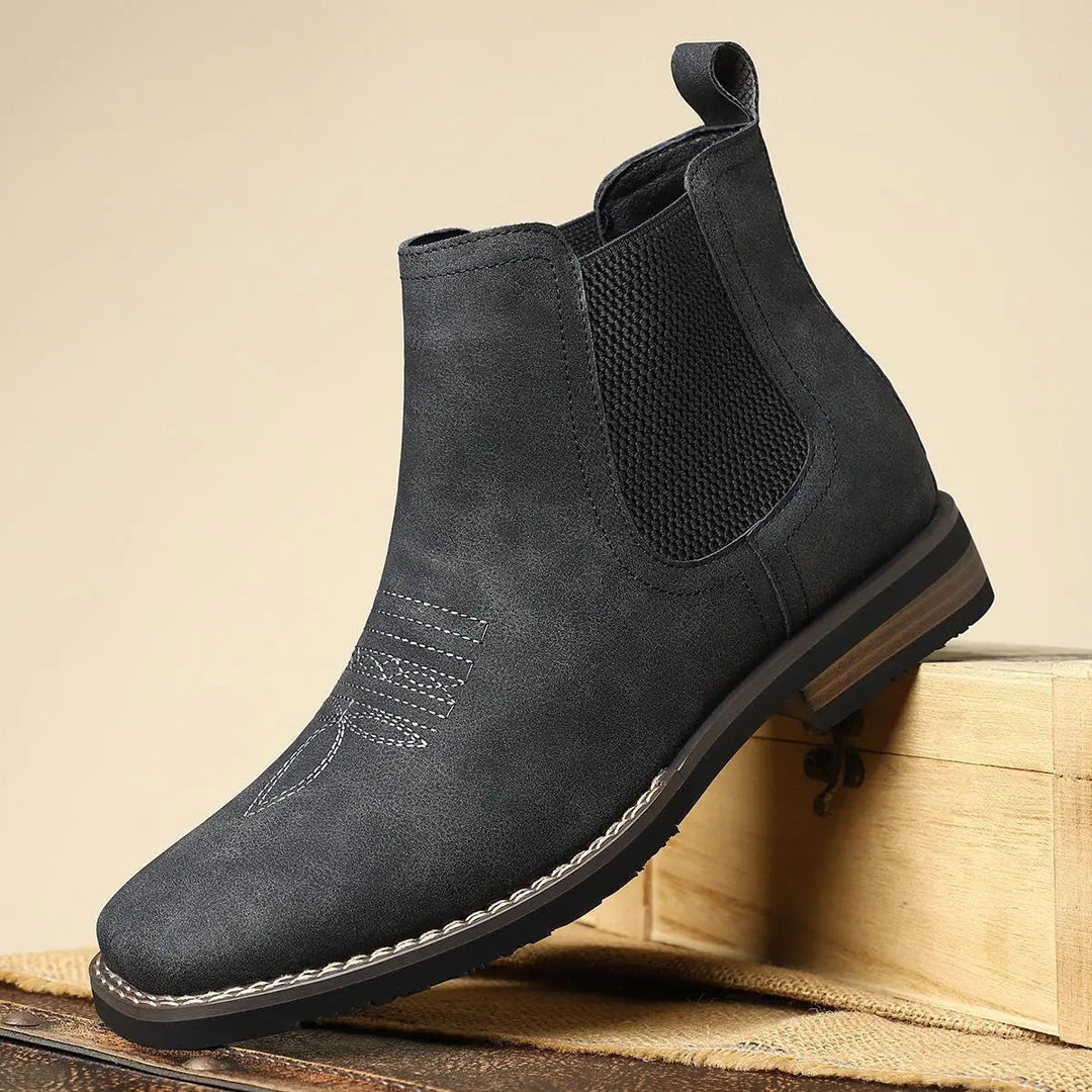 Premium men's leather Chelsea boots, slip-on with intricate western stitching. Versatile smart casual style.