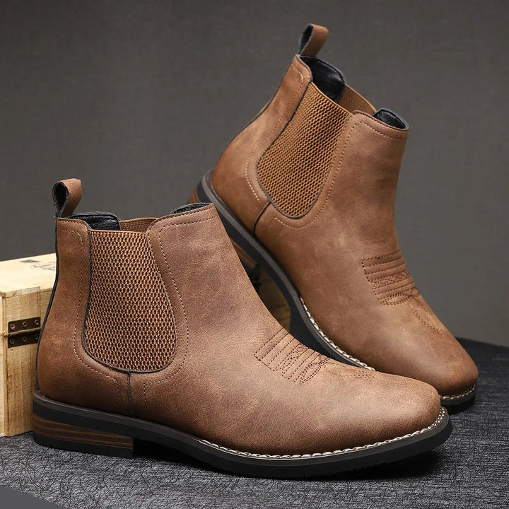 Classic men's black Chelsea boots, slip-on design with a subtle western stitch. Great for everyday fashion.