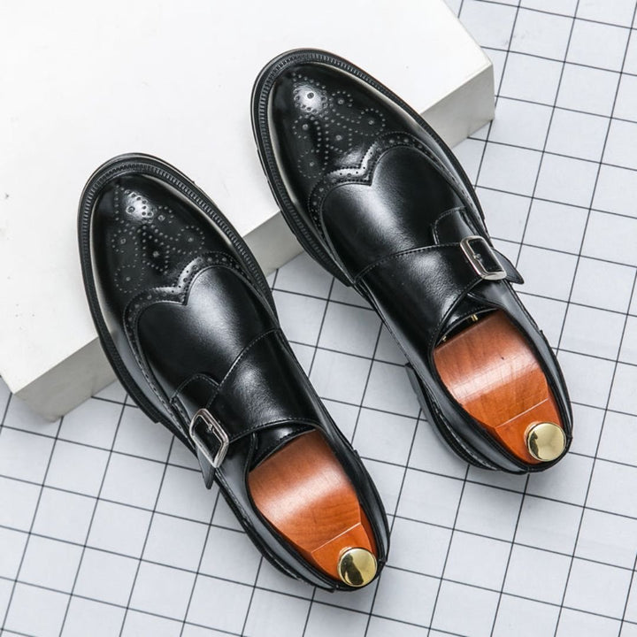 Men's brown leather monk strap wingtip brogue dress shoes for formal or business attire, classic style.