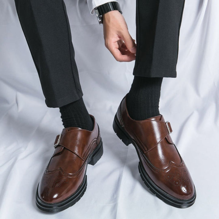 Full shot of elegant men's black monk strap wingtip brogue dress shoes, versatile for formal & smart casual outfits.