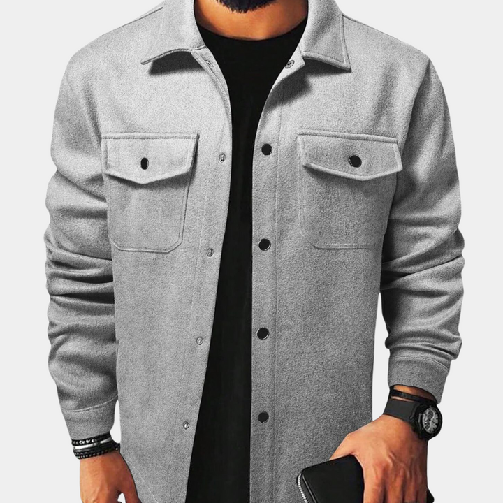 Close-up of stylish men's long-sleeve button-down jacket, showcasing fabric & button details. Smart casual outerwear.