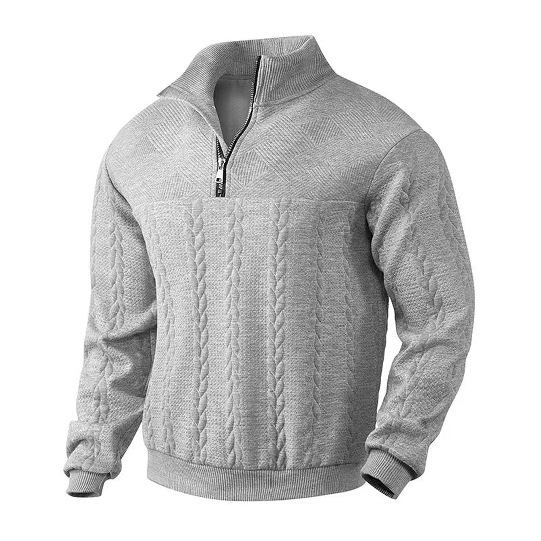 Men's cable-knit quarter-zip pullover sweater for smart casual layering. Winter fashion knitwear.