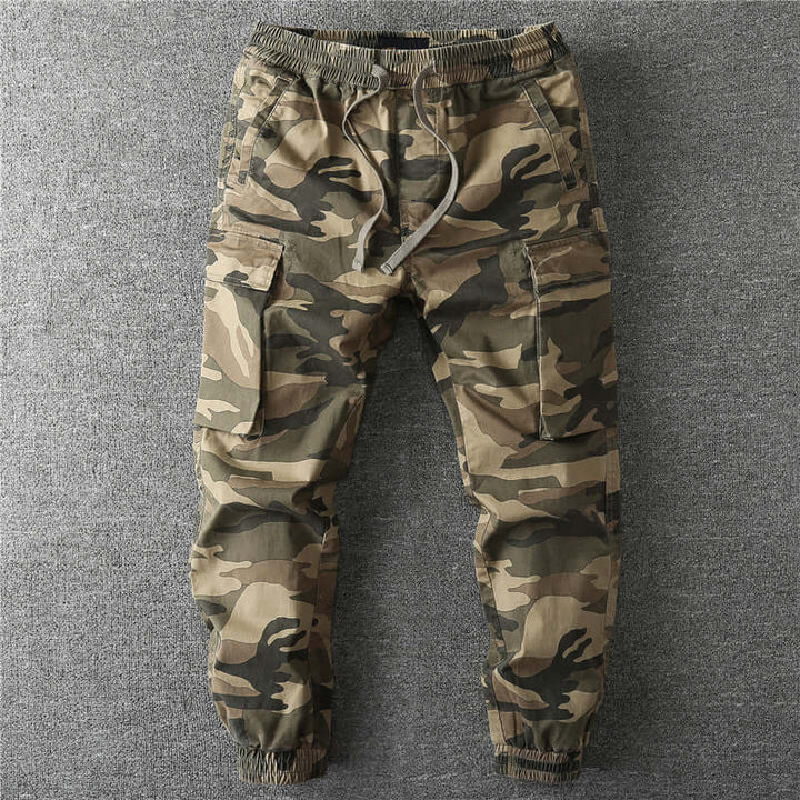 Men's camouflage cargo trousers for outdoor adventures. Durable utility pants, perfect for hiking and exploration.