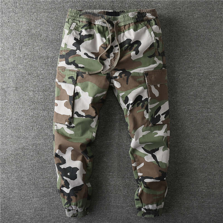 Utility men's camouflage cargo trousers with multiple pockets, ideal for outdoor adventures & everyday casual comfort.