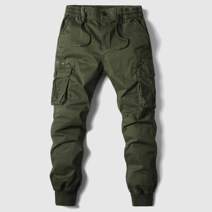 Green men's cargo joggers. Durable utility pants with multiple pockets, perfect for outdoor & casual style.