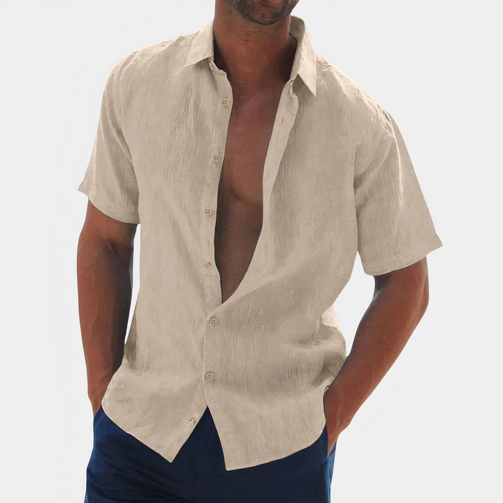 Stylish men's summer button-down shirt. Versatile for casual outings or smart-casual occasions. Lightweight & comfortable.