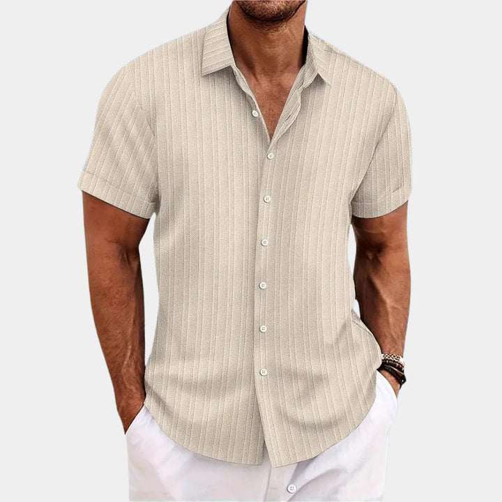 Men's relaxed fit button-down shirt, ideal casual summer wear for warm weather comfort.