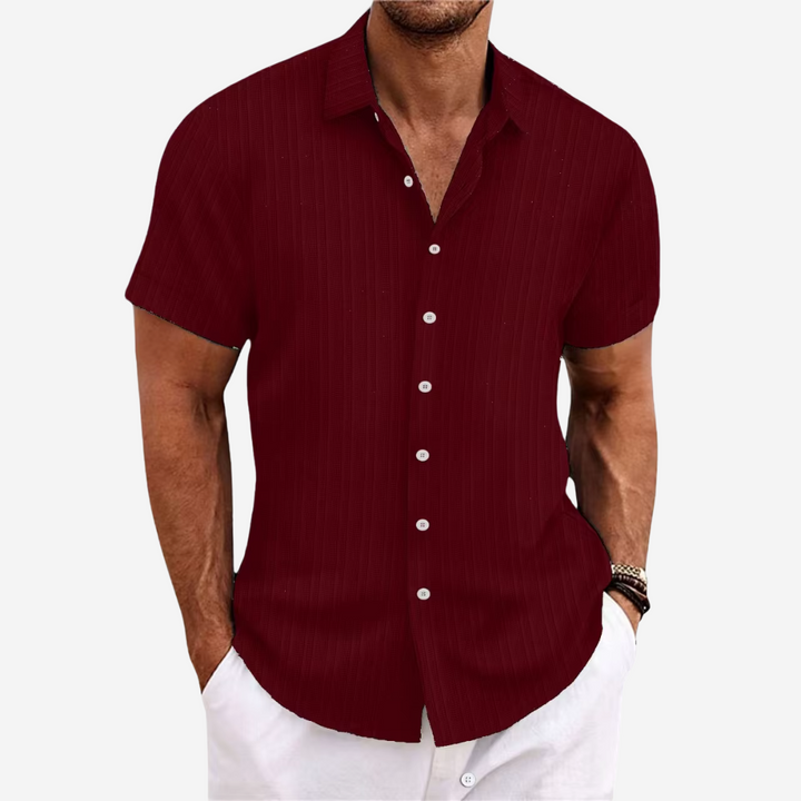 Modern men's casual button-down shirt, relaxed fit, ideal for versatile summer and warm weather style.