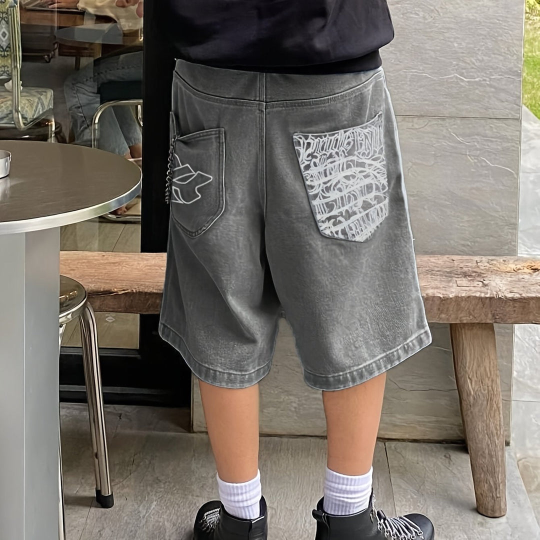Stylish men's fashion: Bermuda shorts with unique floral embroidery design, loose-fit denim.