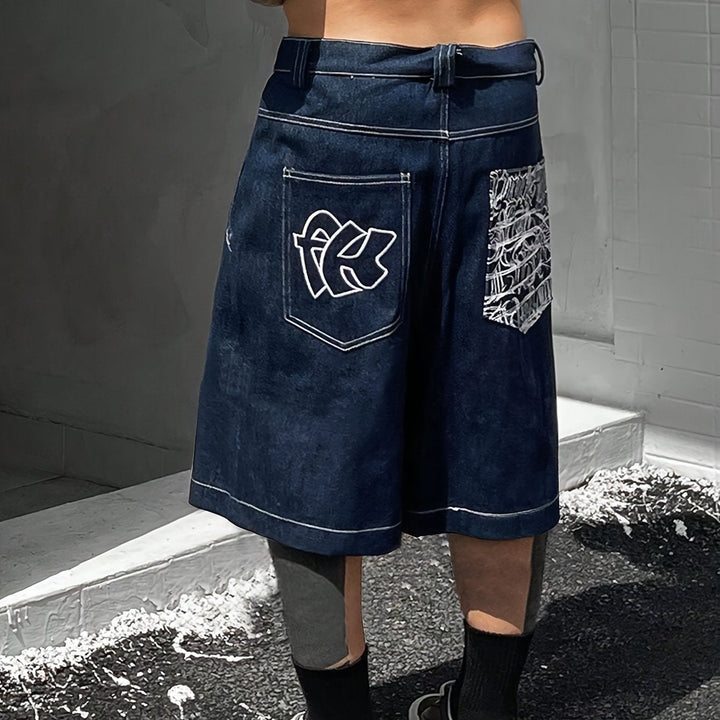 Men's loose-fit casual shorts, with intricate floral embroidery details. Comfortable summer denim.