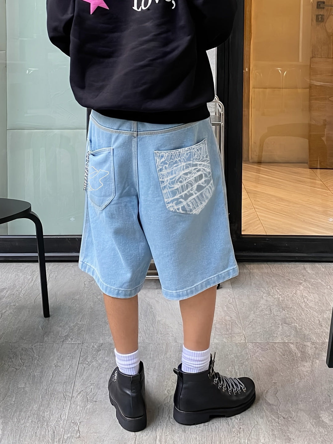 Comfortable men's embroidered denim shorts, featuring a unique floral pattern; great for summer.
