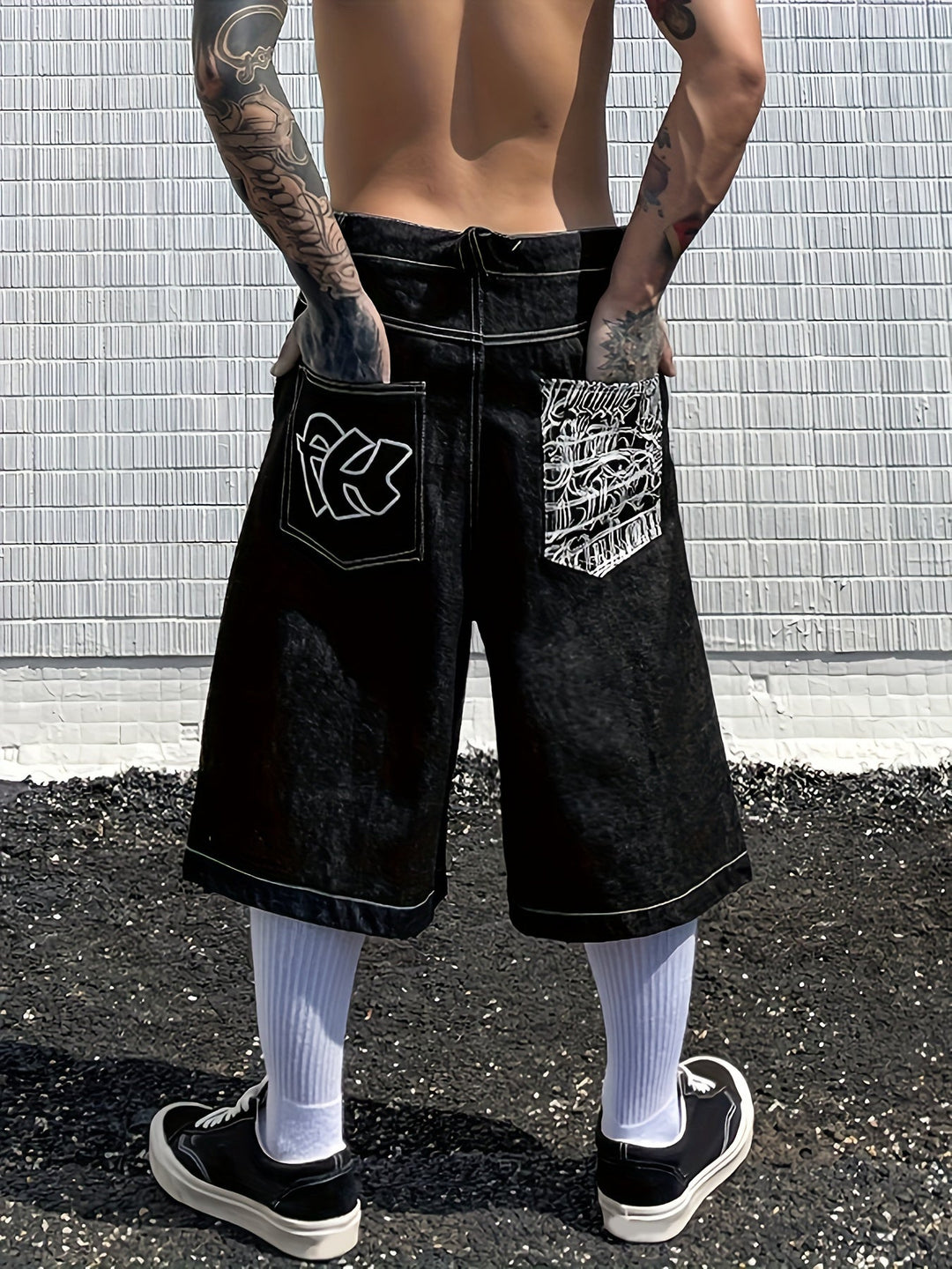 Men's fashionable summer shorts with vibrant floral embroidered design. Loose-fit denim Bermuda.