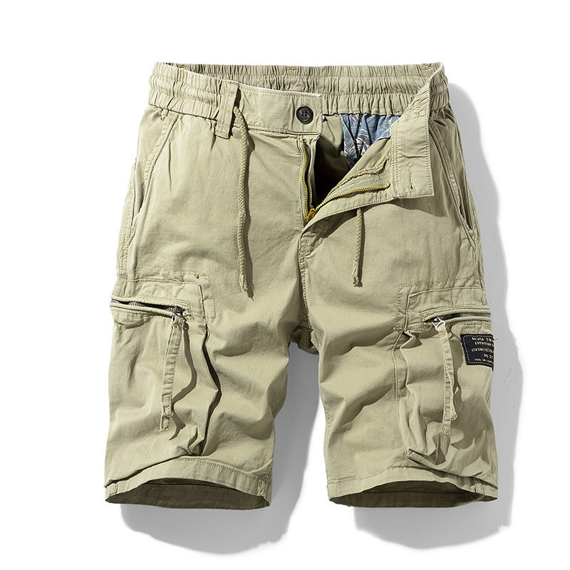 Man wearing relaxed fit men's drawstring cargo shorts, enjoying outdoor comfort and casual summer style.