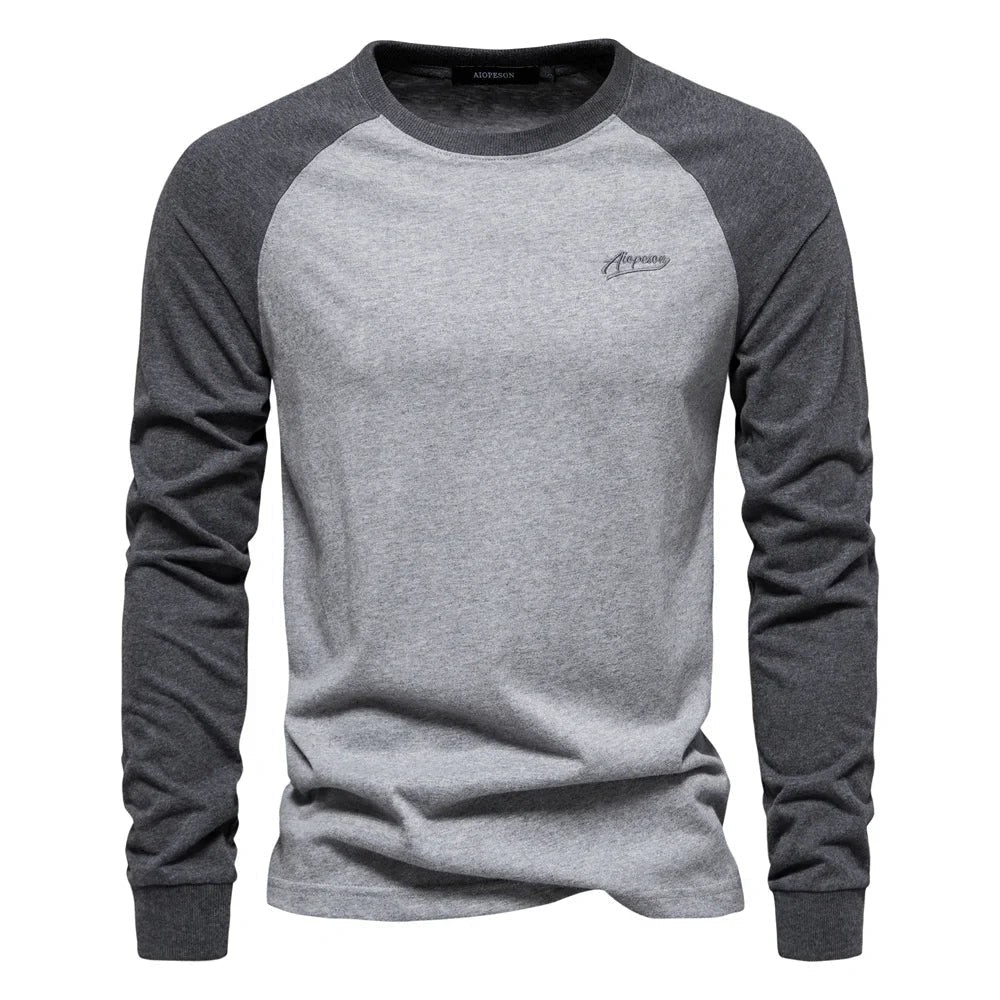 Modern men's raglan long sleeve top, featuring a crew neck for casual comfort & versatile layering.